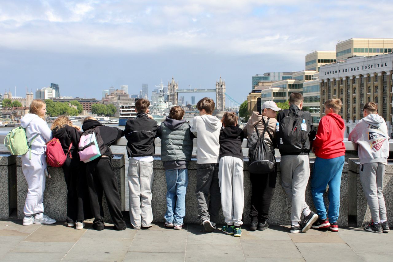 Group Of Teenagers Overlooking Tower Bridge In London 32668247